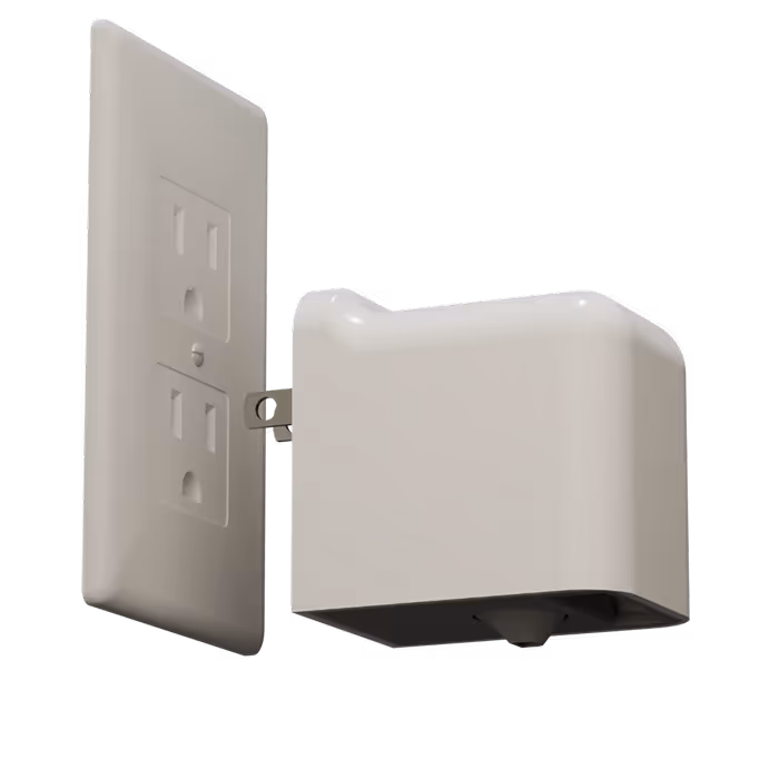 A standard wall plug and a Scorpion Detector about to be plugged in.